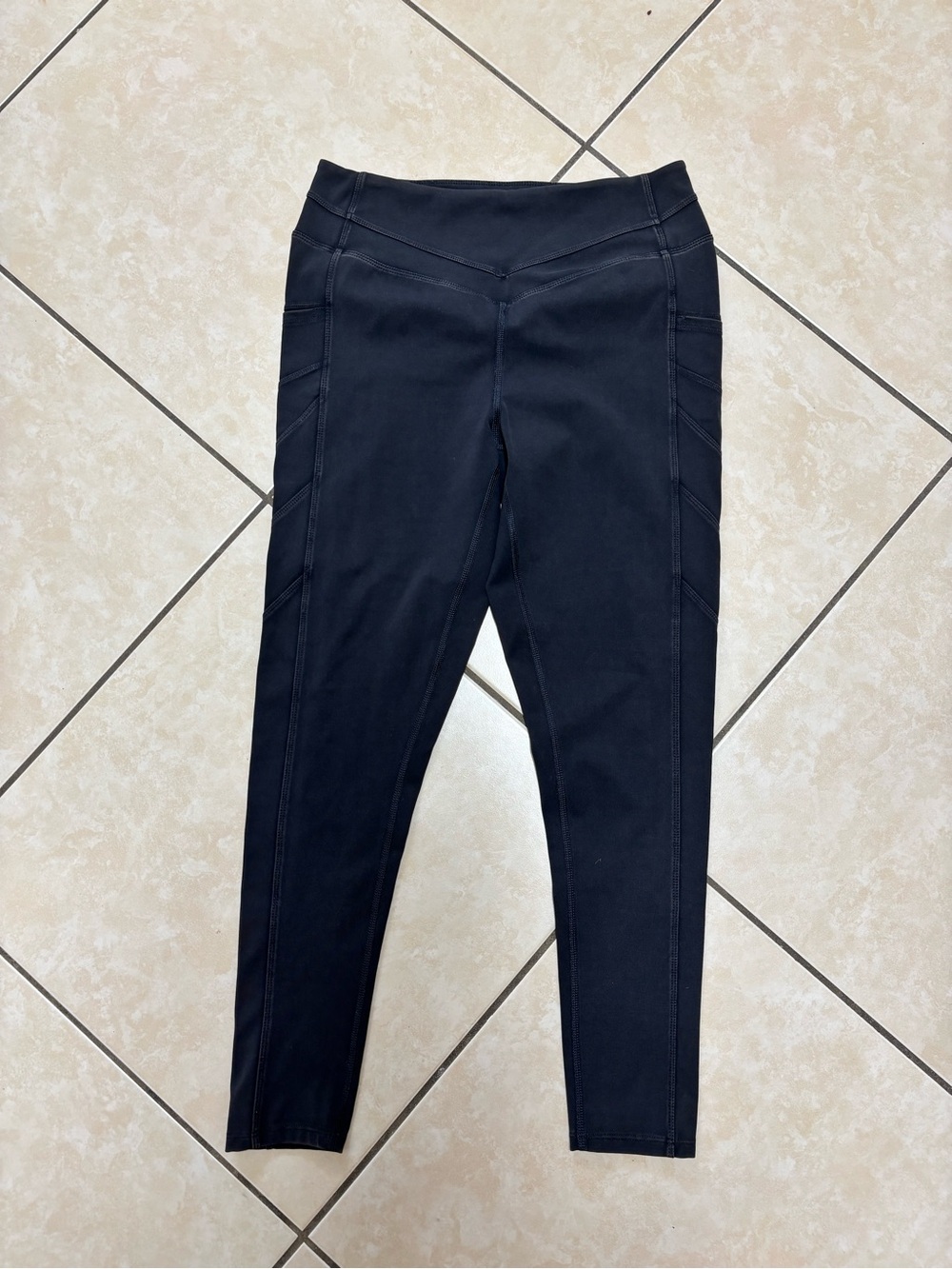 Free people black leggings with diagonal seam detailing, size M